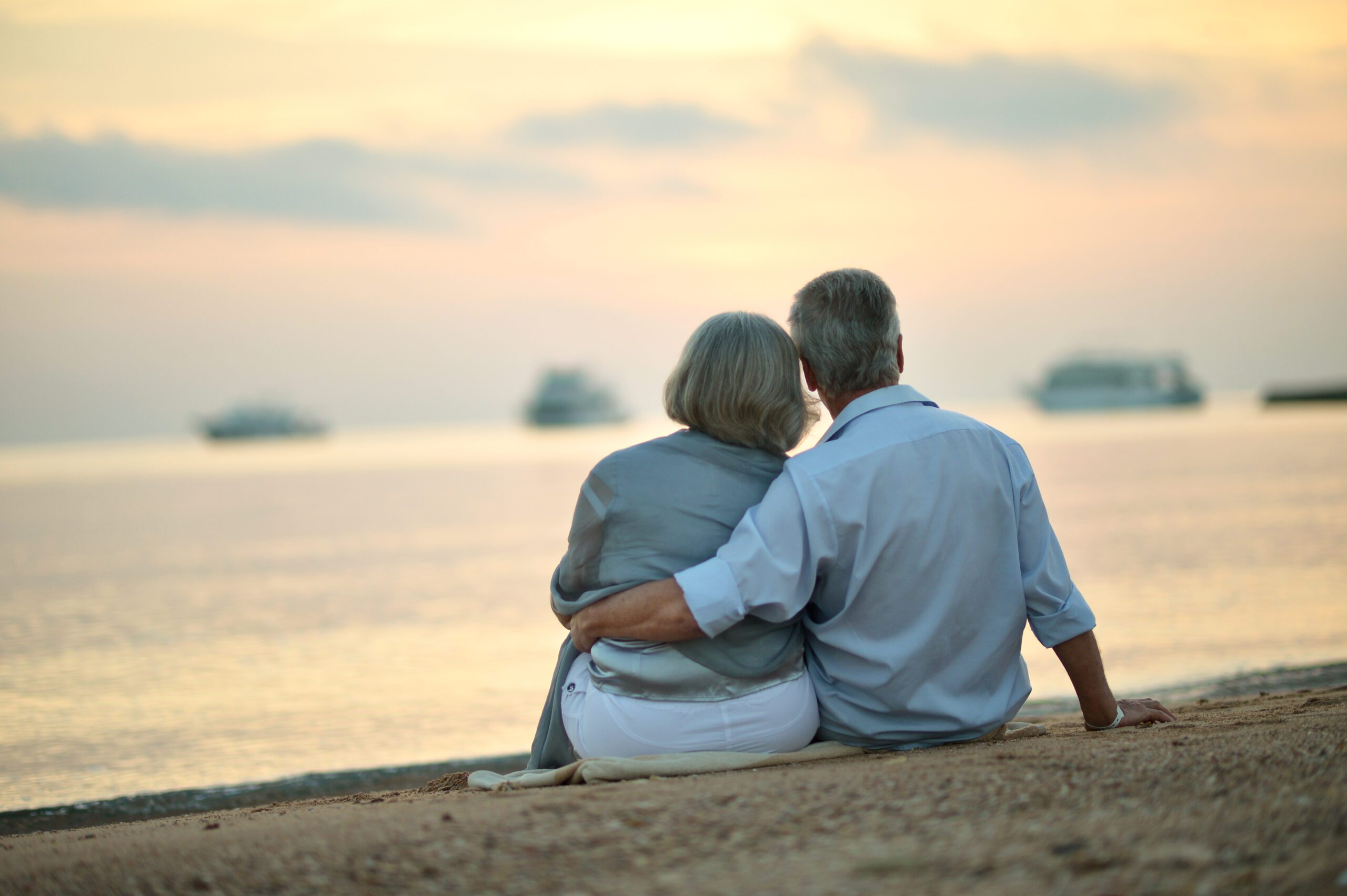 Portrait of mature couple relaxing on beach